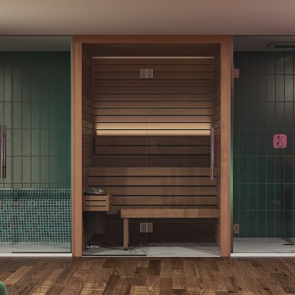 The Cala Sauna in front of a green wall.