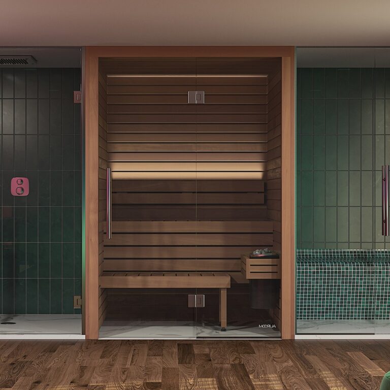 The Cala Sauna in front of a green wall.