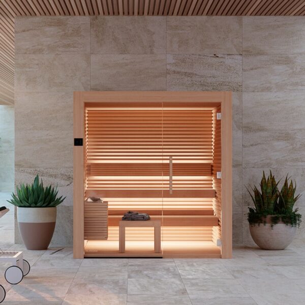 The Nativa Alder Indoor Sauna next to pot plants.