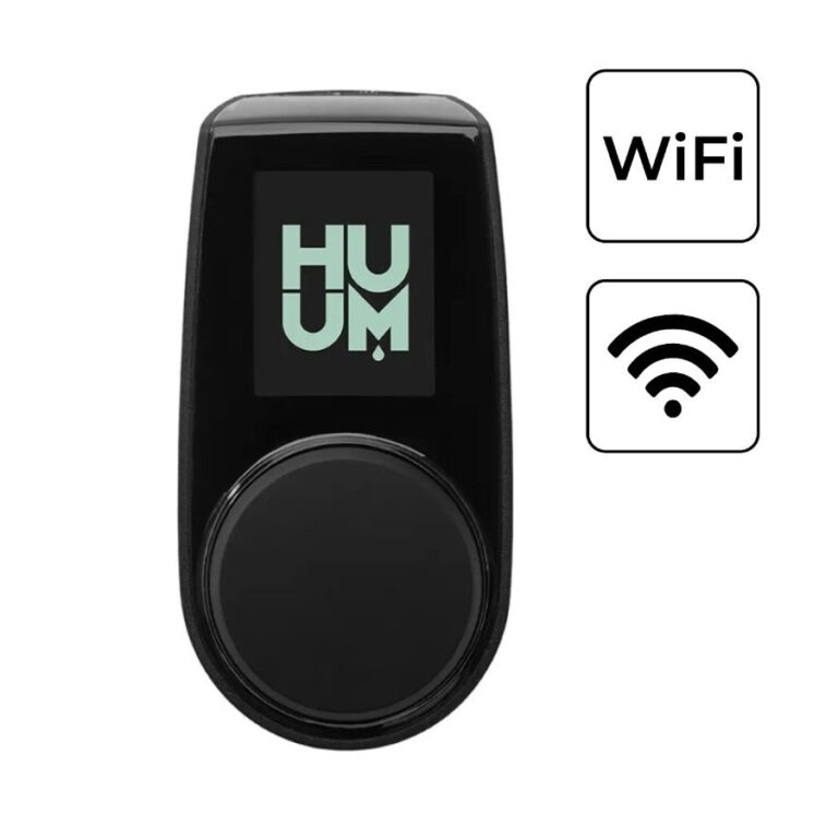Black handheld device featuring a large circular control dial and a small screen displaying the 'HUUM' logo, shown alongside Wi‑Fi/wireless icons to indicate wireless connectivity.