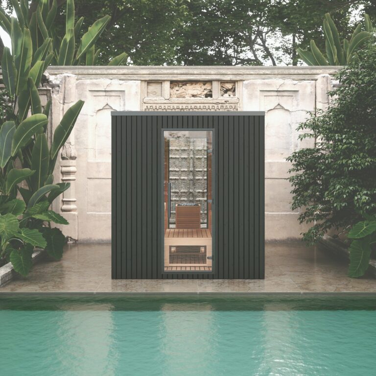 The 'Garda' Black Outdoor Sauna in front of a pool