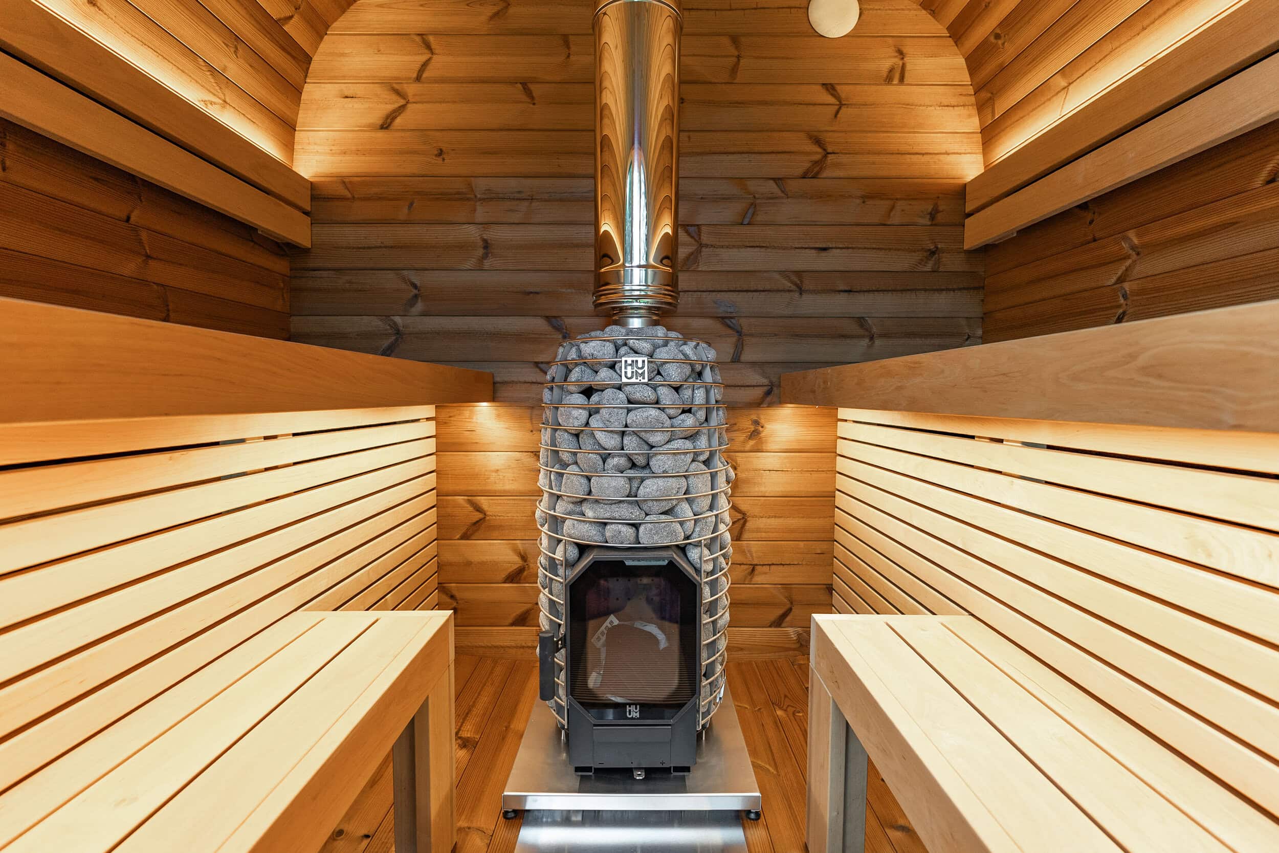 Facing benches inside the Black Cube Sauna