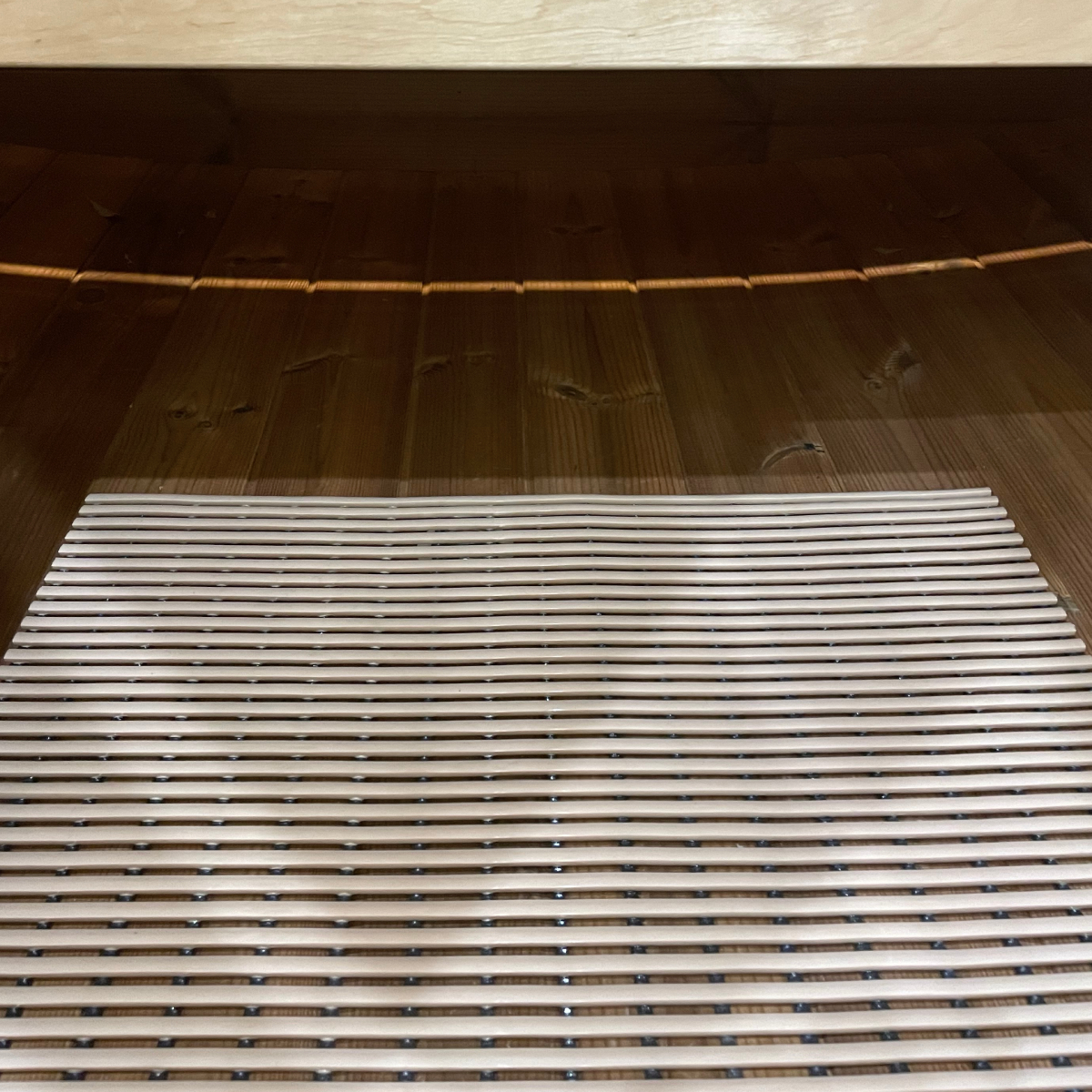 Floor mat in Dice Sauna.