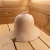 Beige Bell Shaped Sauna Hat on sauna bench.
