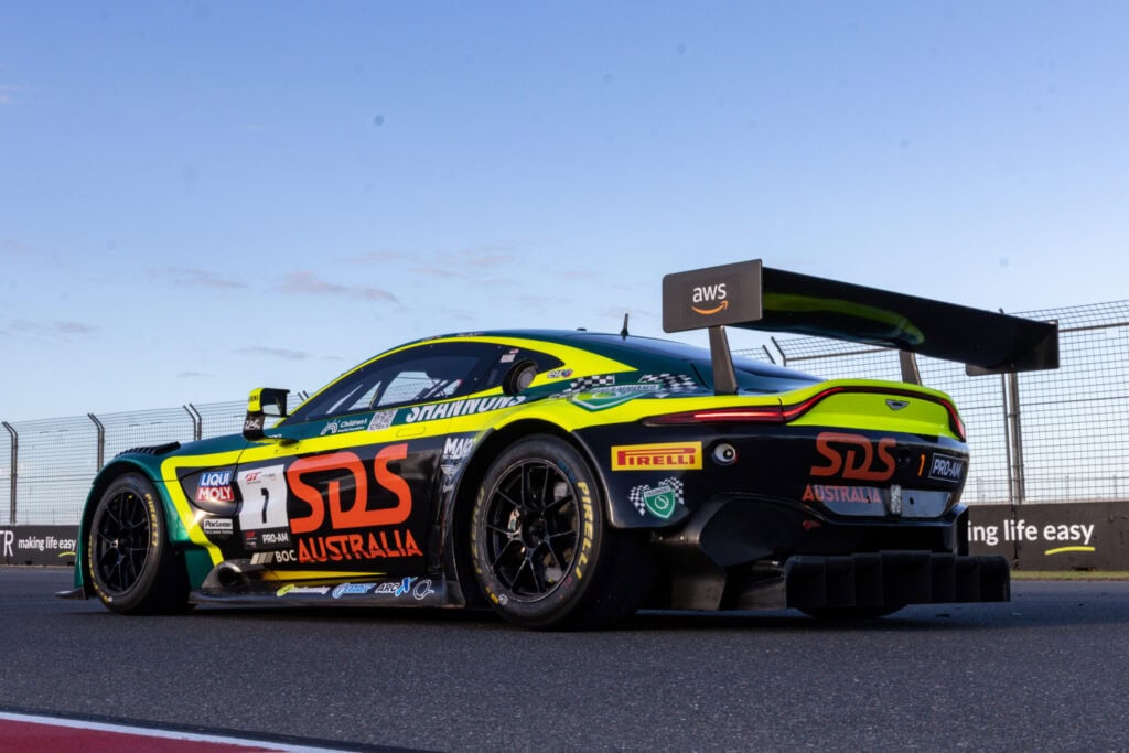 A Volante Rosso racecar in full flight with SDS Australia featured on the side.