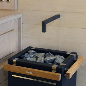 Black Piping for the Harvia Autodose Dispenser System above a heater.