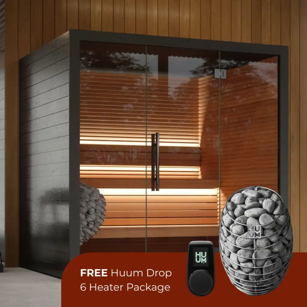 Promo image advertising a FREE Huum Drop 6 Heater Package, showing a glass sauna door, warm wooden interior, and a basket of sauna stones.