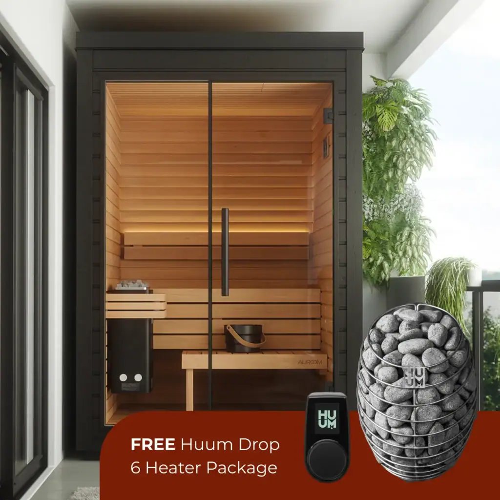 Outdoor sauna with glass door and warm wooden interior; bottom promo text says 'FREE Huum Drop 6 Heater Package'