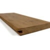 Brown wooden plank viewed from an angle, showing a groove along the edge and a hollow underside.