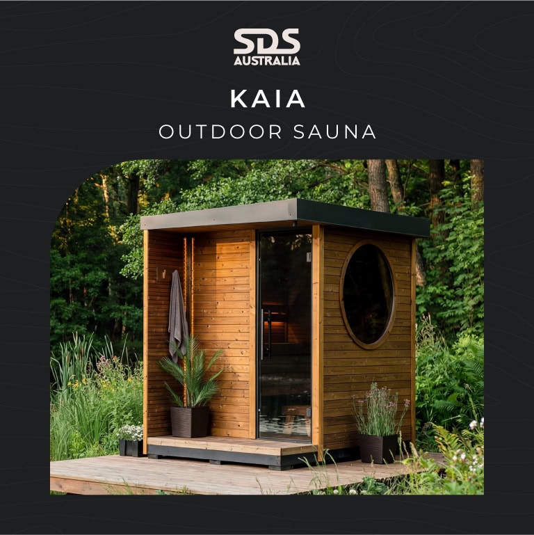 SDS Australia Kaia outdoor sauna cabin in a garden, with a round window and glass door.