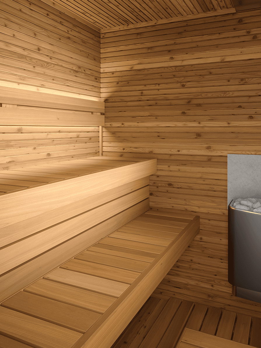 Wooden sauna interior with two-tier benches and a heater with stones in the corner.